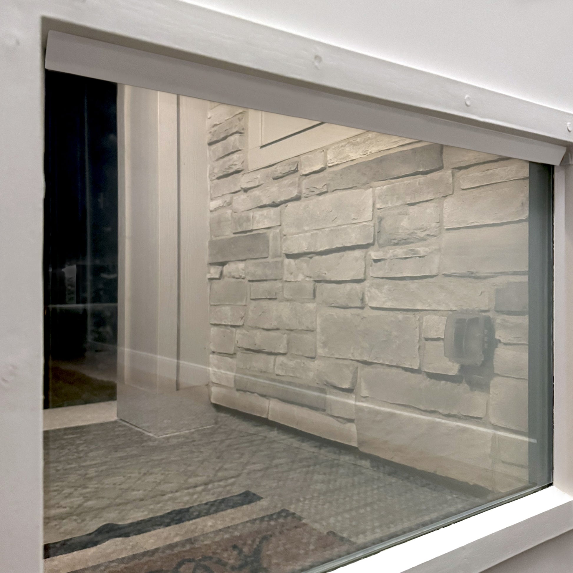 Window with white Smarter Trim installed along top edge, text overlay reading ‘Smart Trim adds the finishing touch to window smart films’.